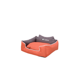 Orange pet bed with gray interior on a white background
