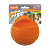 Orange Nylabone b-ball gripz dog toy with packaging on a white background