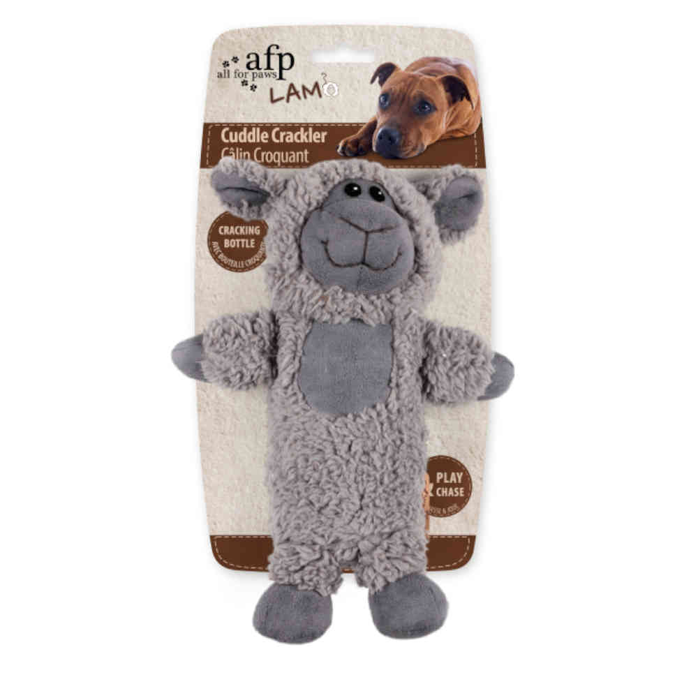 Gray plush lamb toy with packaging on a white background