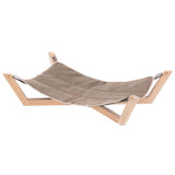 Beige hammock on a wooden stand against a white background