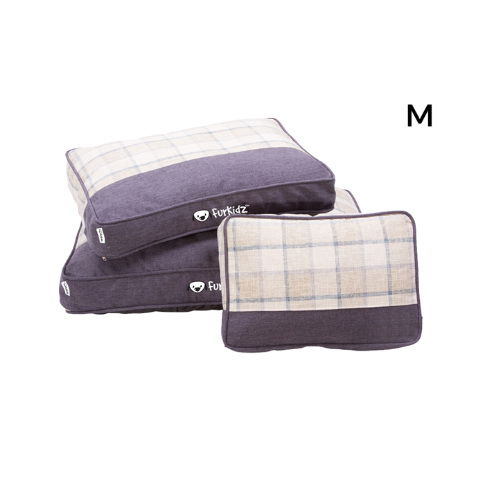 Set of three pet pillows with plaid and solid designs on a white background