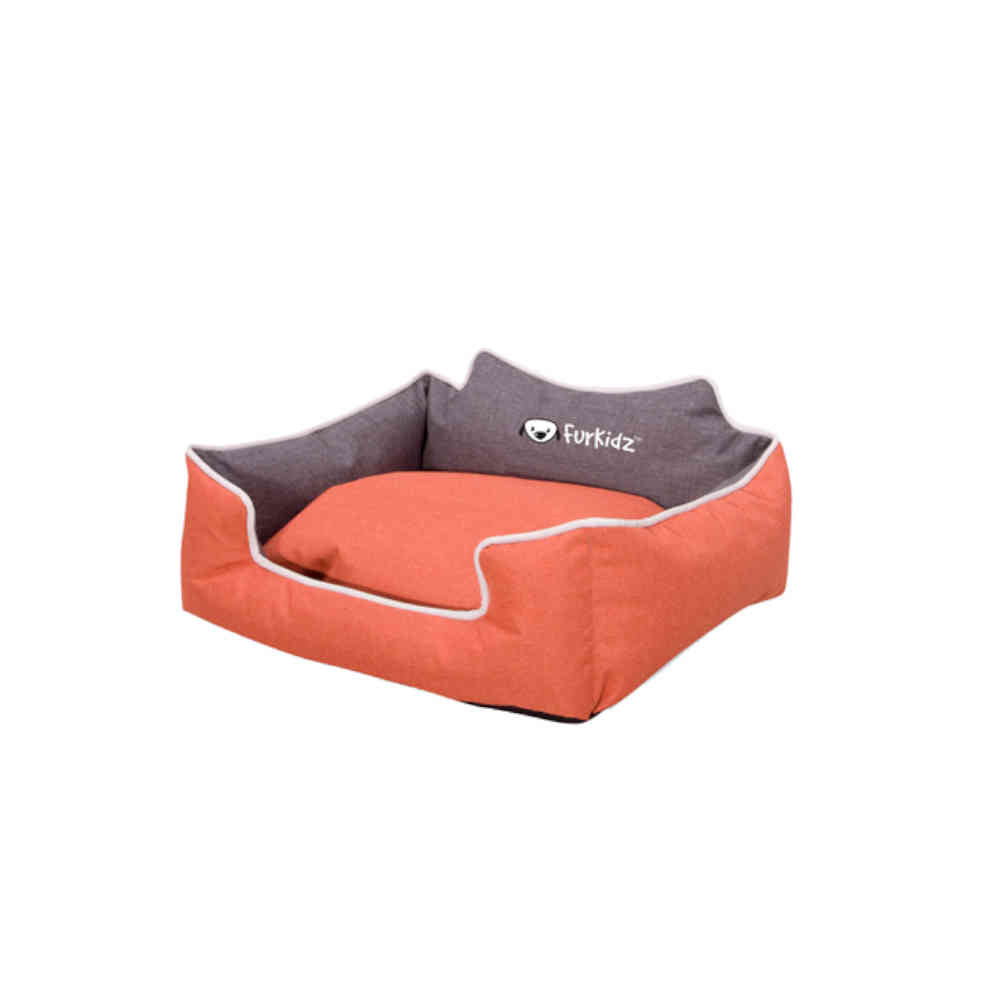 Orange pet bed with gray cushion on a white background