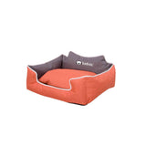 Orange pet bed with gray cushion on a white background