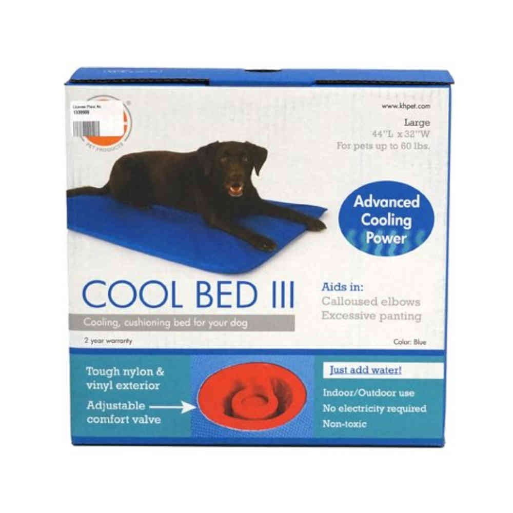 Box of Cool Bed III cooling pad for dogs with a dog lying on it.