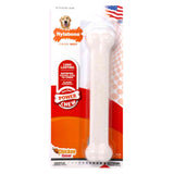 Nylabone dog chew toy packaging with a white bone and red label on a white background