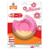 Pink donut-shaped dog toy with Nylabone branding on its packaging.