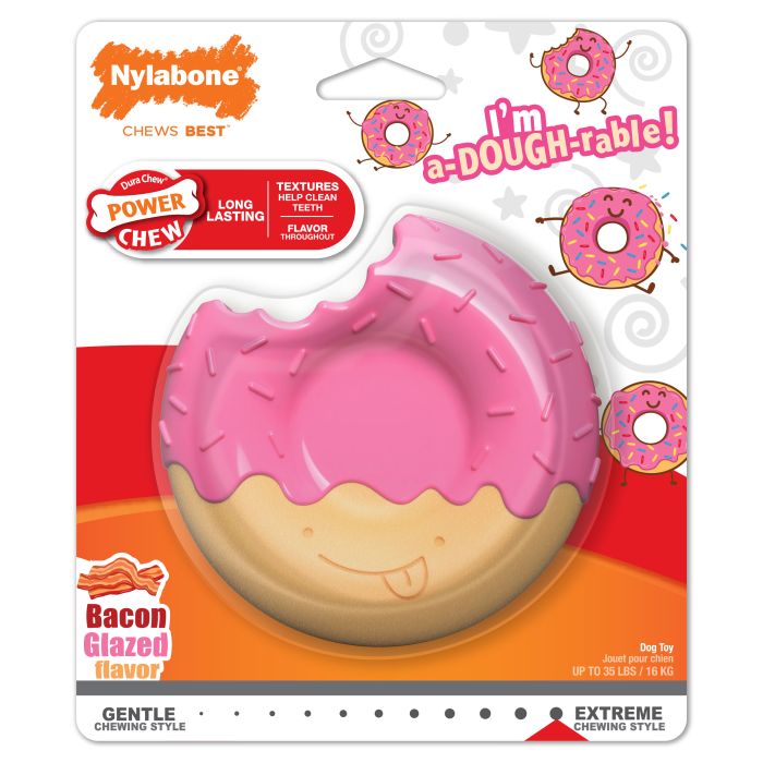 Pink donut-shaped toy with Nylabone branding on a colorful packaging background.