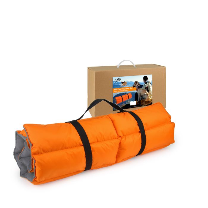 Orange inflatable mat with black straps in front of a cardboard box on a white background