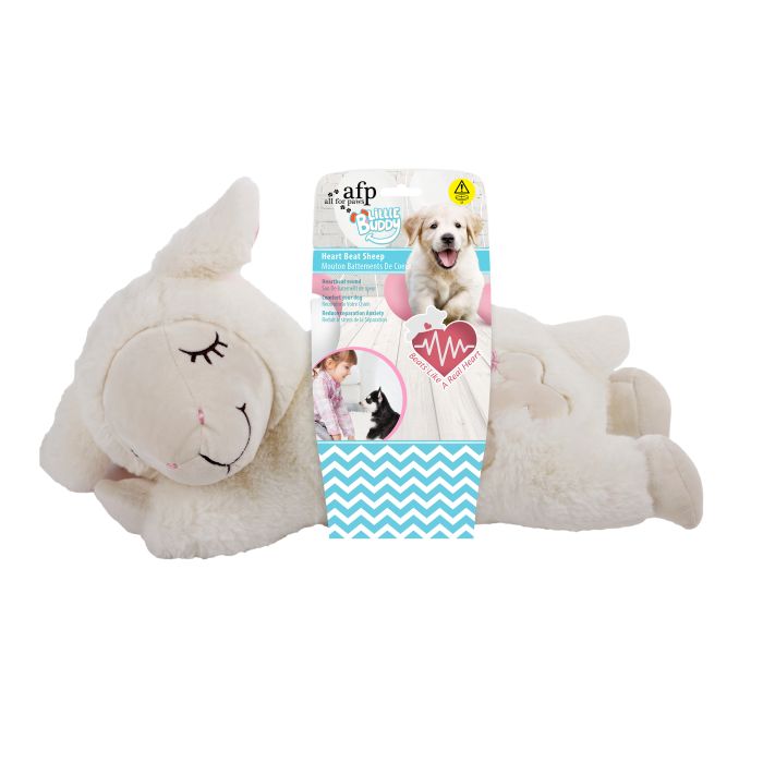 Plush sheep toy with a packaging box featuring a dog on a white background