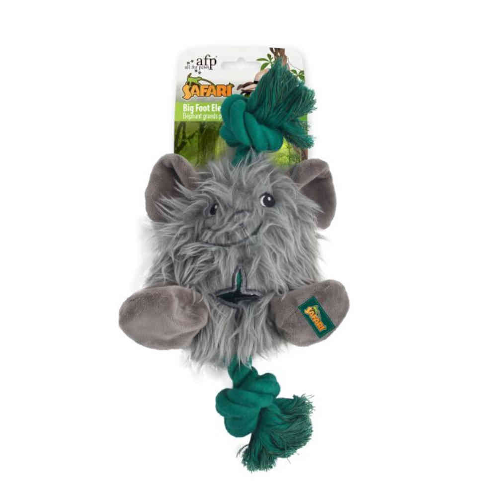 Plush toy resembling a rodent with a green rope on a white background